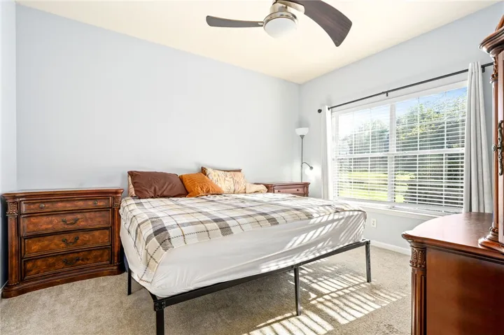Plentiful natural light streams through a large window overlooking the verdant outdoors.
