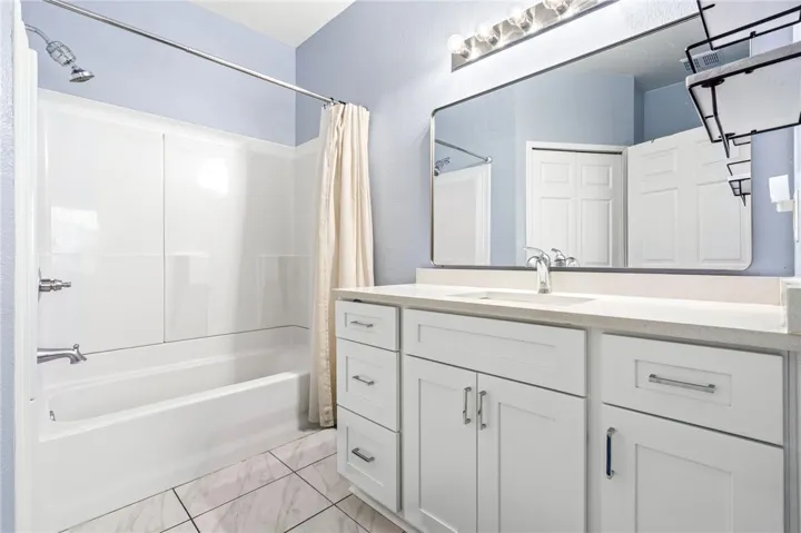 Clean lines and a spacious vanity highlight this modern bathroom space.
