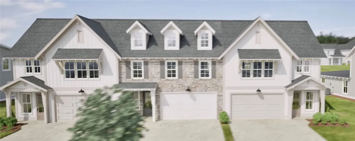 Gabled rooflines and classic masonry accents define this striking multi-family exterior design.