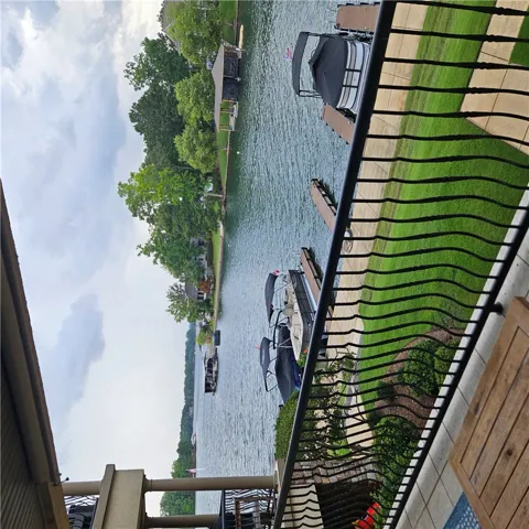 Lakeside views extend past the private boat docks and manicured lawn from this elevated vantage point.