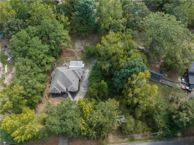 Mature trees surround this private property, offering natural privacy and a peaceful environment.