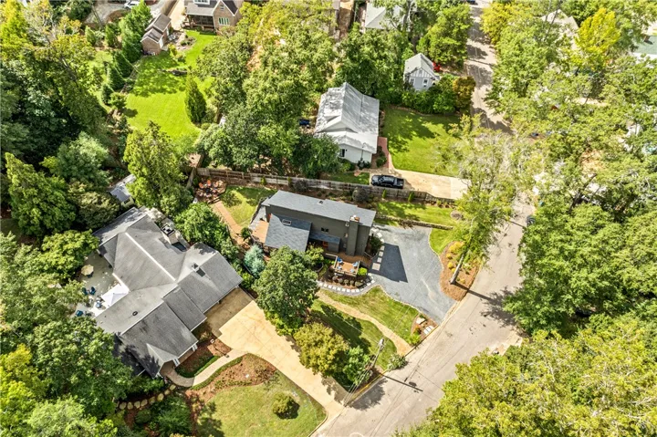 Mature trees surround this home situated within a quiet residential neighborhood.