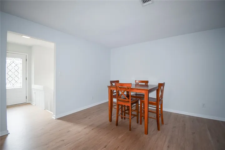 Smooth wood floors flow effortlessly through this light-filled dining space.