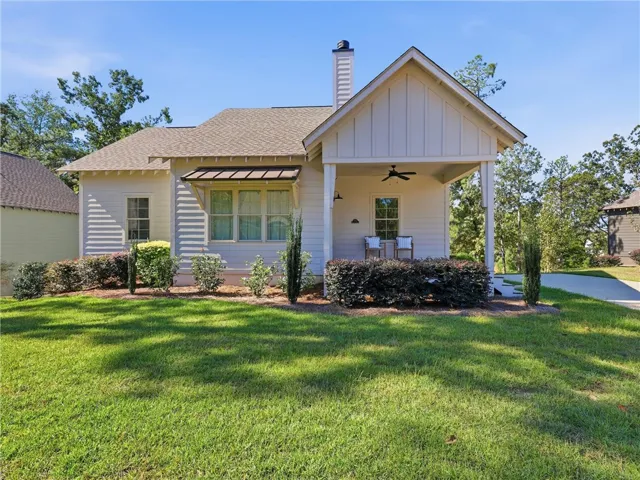 Neat siding and a classic gabled porch frame this charming single-story home.