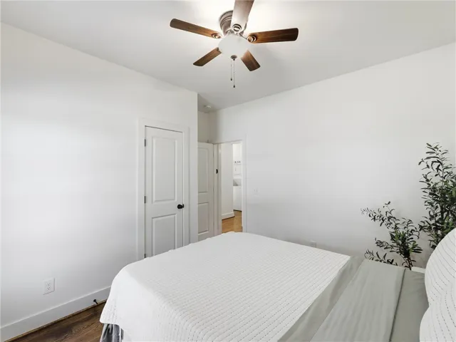 Rich hardwood flooring anchors this inviting space featuring clean walls and generous natural light.