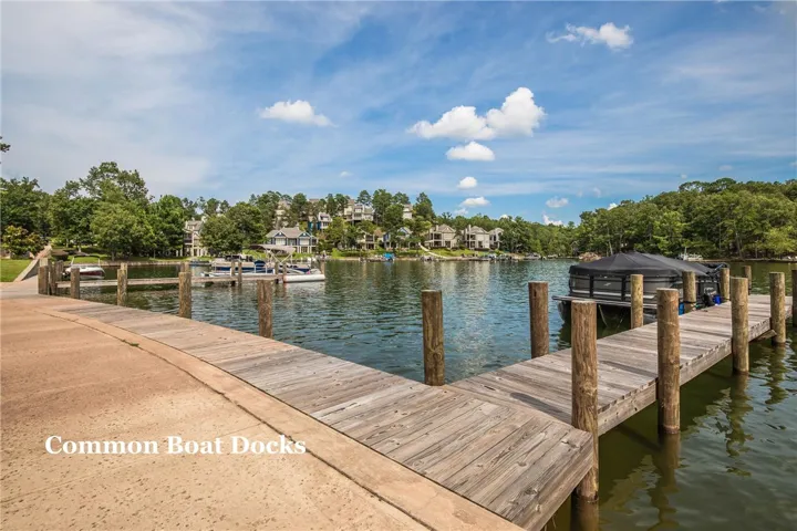 Stretching into the water, a wooden pier provides convenient neighborhood lake access.