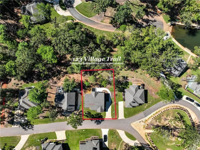 Mature trees surround this home highlighted within its approximate property boundaries.