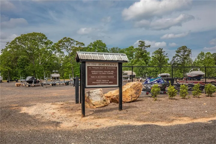 Ample parking options are available in this designated secure area surrounded by nature.