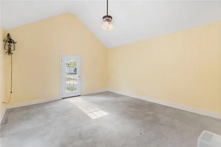 Vaulted ceilings and durable concrete flooring define this versatile interior space.