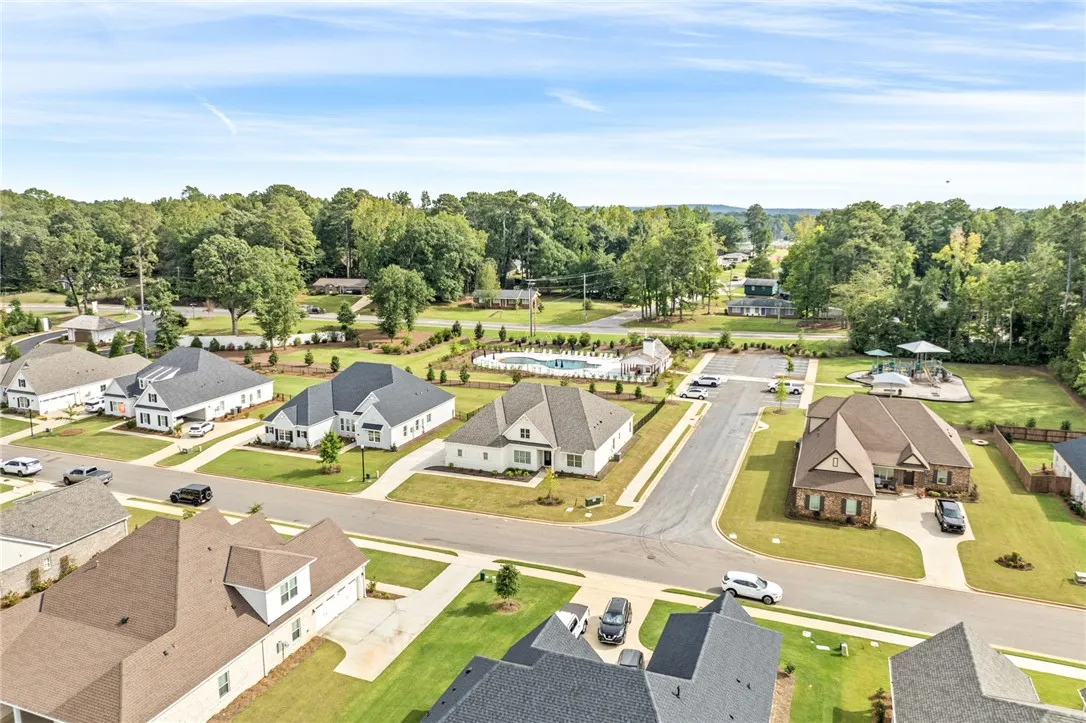 Manicured lawns and sidewalks connect charming modern homes in this peaceful, tree-lined neighborhood.