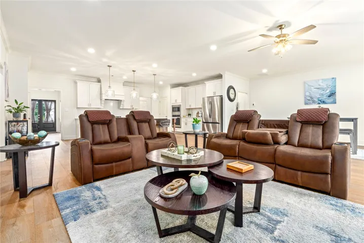 An open concept floor plan seamlessly connects the comfortable living space to the kitchen.