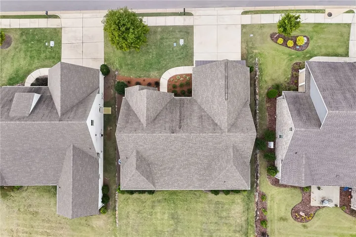 An aerial perspective showcases the classic rooflines and manicured lawns of this neighborhood setting.