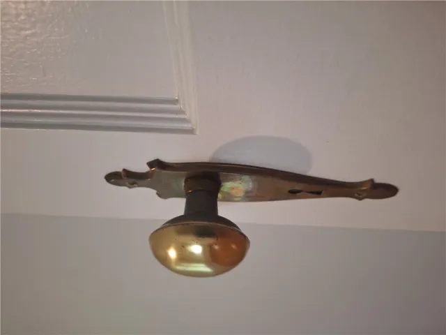 Vintage brass hardware accents the classic interior doors throughout this home.