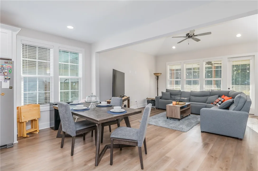 An open floor plan connects the dining area with a light-filled living space.