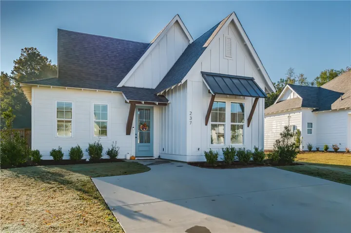 Gabled rooflines and board-and-batten siding define this modern cottage exterior.