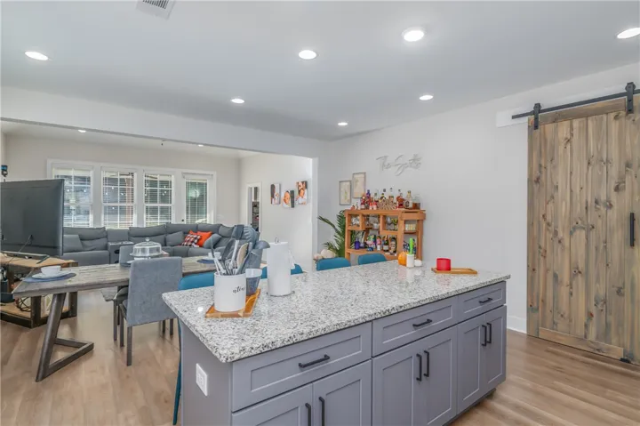 An open kitchen layout transitions smoothly into the living spaces beyond.