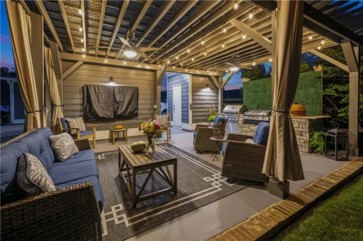 Patio has mounted TV and is surrounded by natural, lush landscape - a true move-in ready gem!