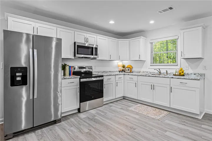 Fridge included in this classy kitchen