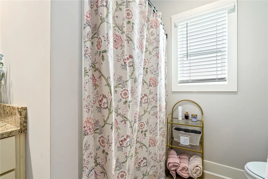 Tub/shower combo with a window for natural light.