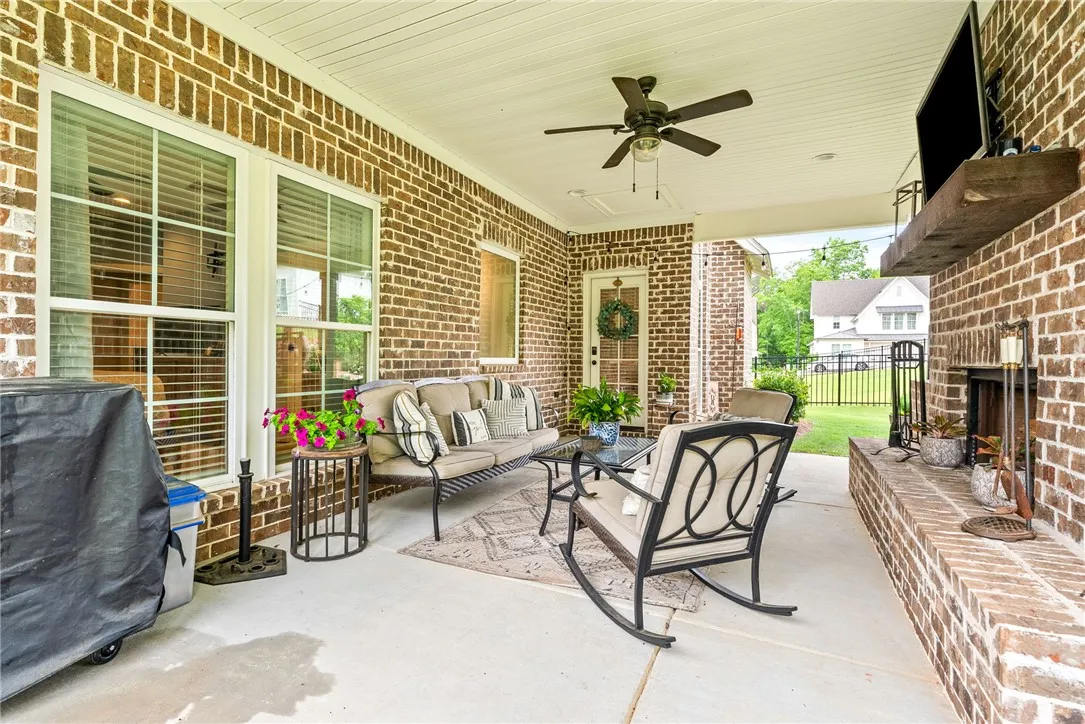 Patio seating area with views of the​​‌​​​​‌​​‌‌​‌‌​​​‌‌​‌​‌​‌​​​‌​​ backyard.