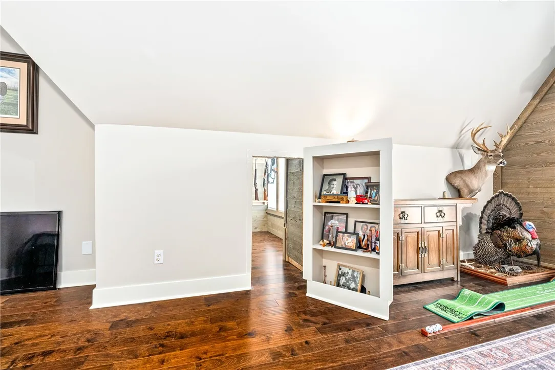 Bookcase door that opens to the upstairs living space.