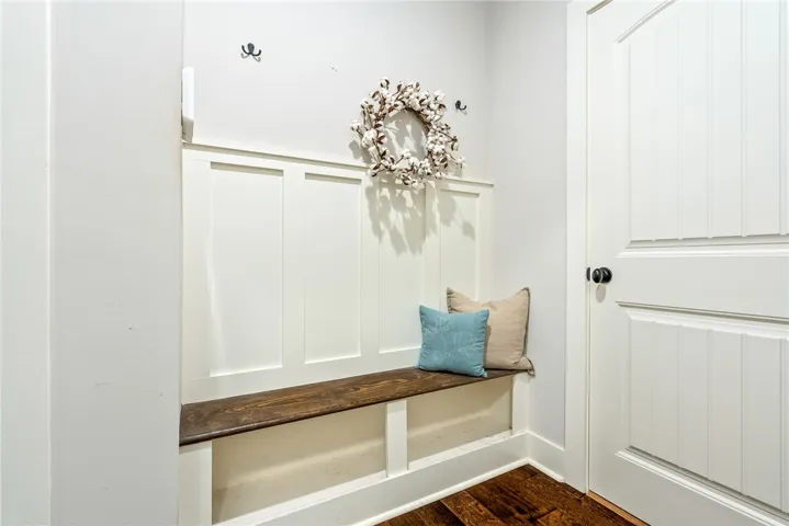 Built-in bench with hooks by the back entry.