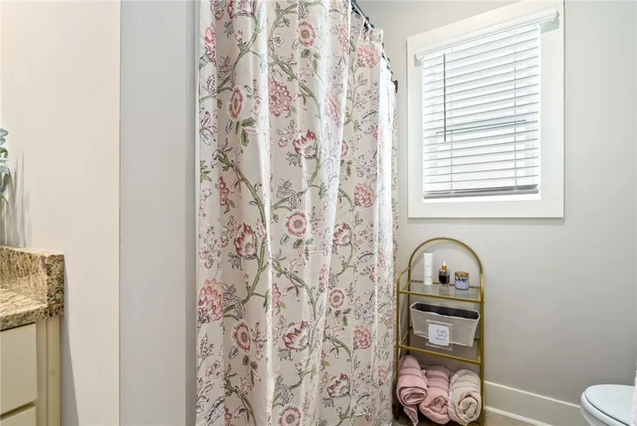 Tub/shower combo with a window for natural light.