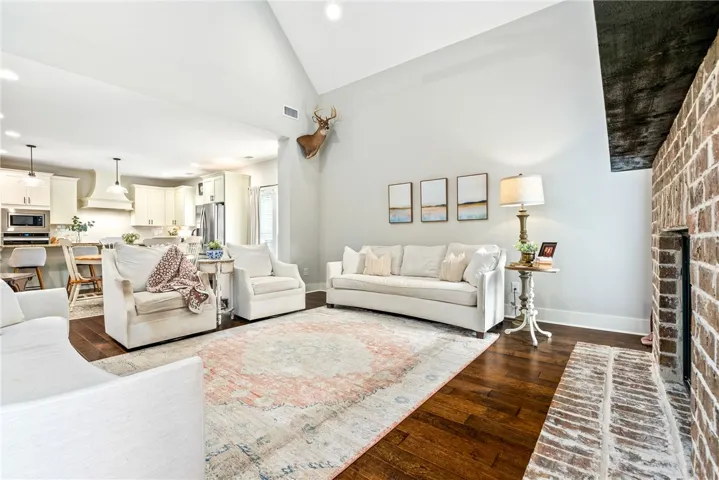 Living room opens to the kitchen and dining area.