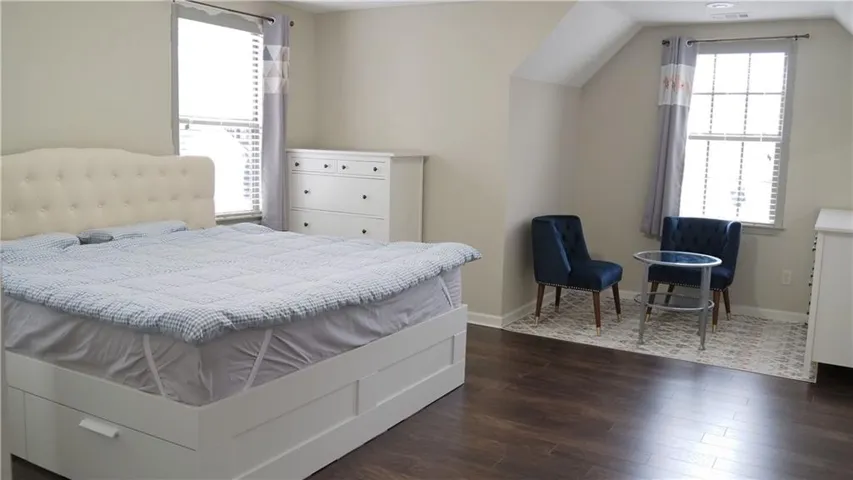 Gleaming hardwood floors and angled ceilings define this quiet upstairs retreat.