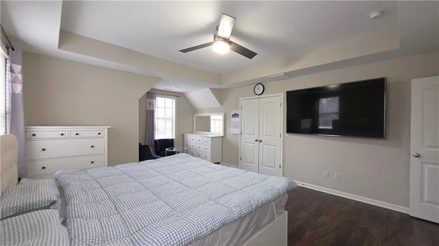 Rich wood floors and elegant tray ceilings define this tranquil retreat.