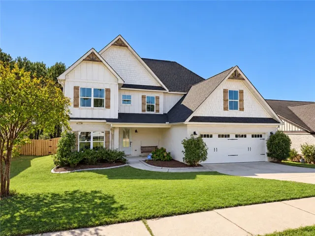 Gable rooflines and classic board and batten details highlight this welcoming front facade.