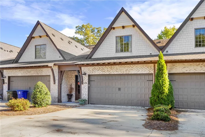 Charming steep gables, classic brick, and shake siding create exceptional curb appeal.
