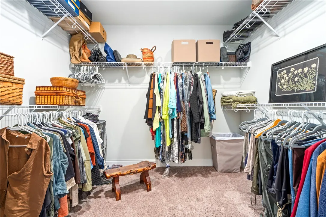 Your primary closet is not only functional it is large enough to be a small room by itself!