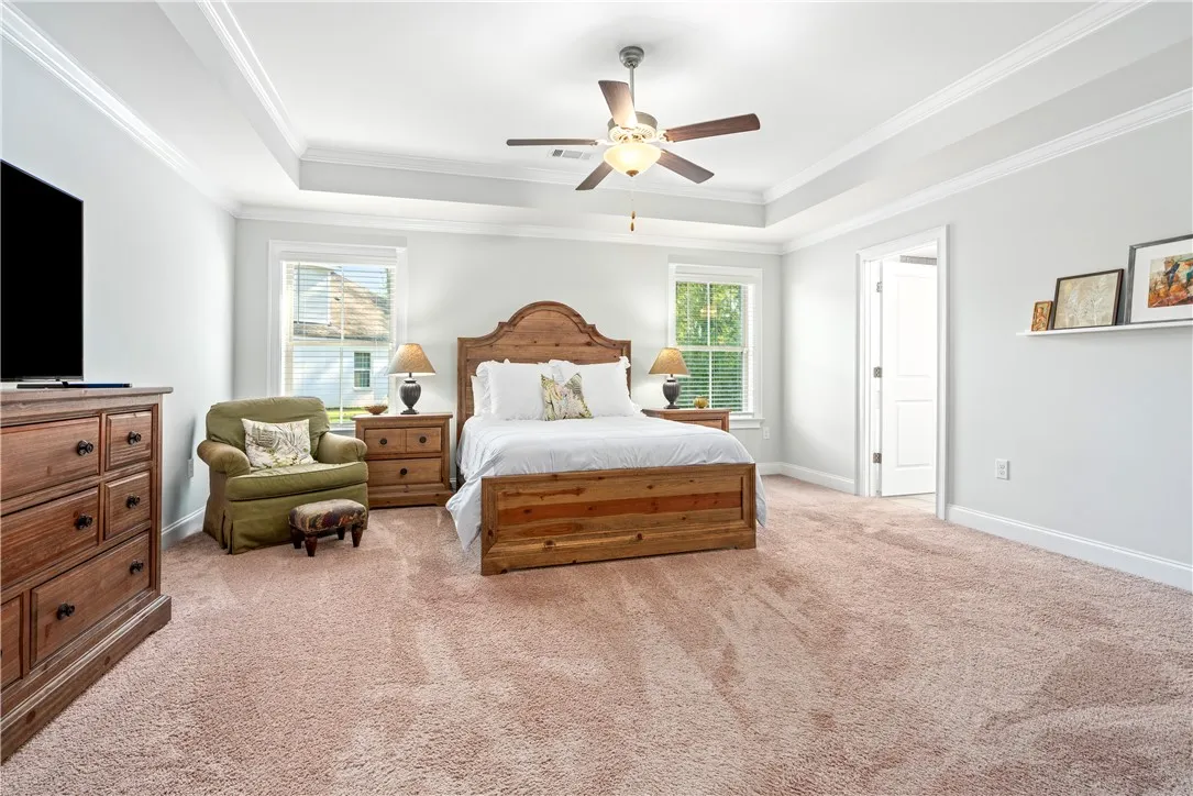 Another view of the primary bedroom showcasing the abundance of space to add a comfy lounge area or a quiet reading corner.