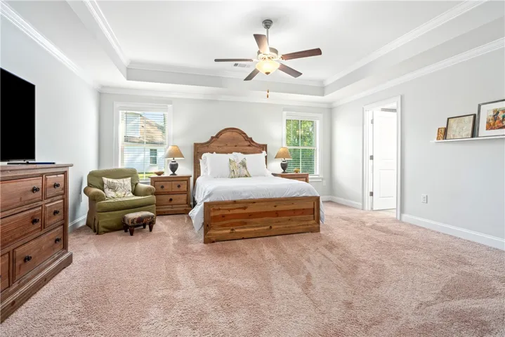 Another view of the primary bedroom showcasing the abundance of space to add a comfy lounge area or a quiet reading corner.