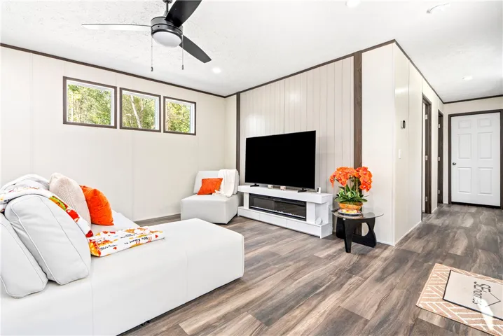 An inviting open floorplan is grounded by handsome wood-look flooring.