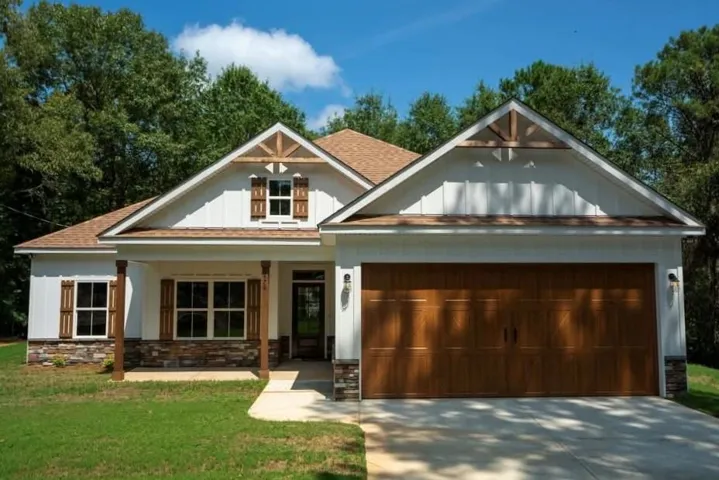 Craftsman architectural details and rustic stone accents elevate this beautiful modern home facade.