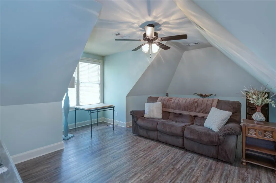 Slanted ceilings create a cozy and inviting atmosphere in this upper-level living​​‌​​​​‌​​‌‌​‌‌​​​‌‌​‌​‌​‌​​​‌​​ space.