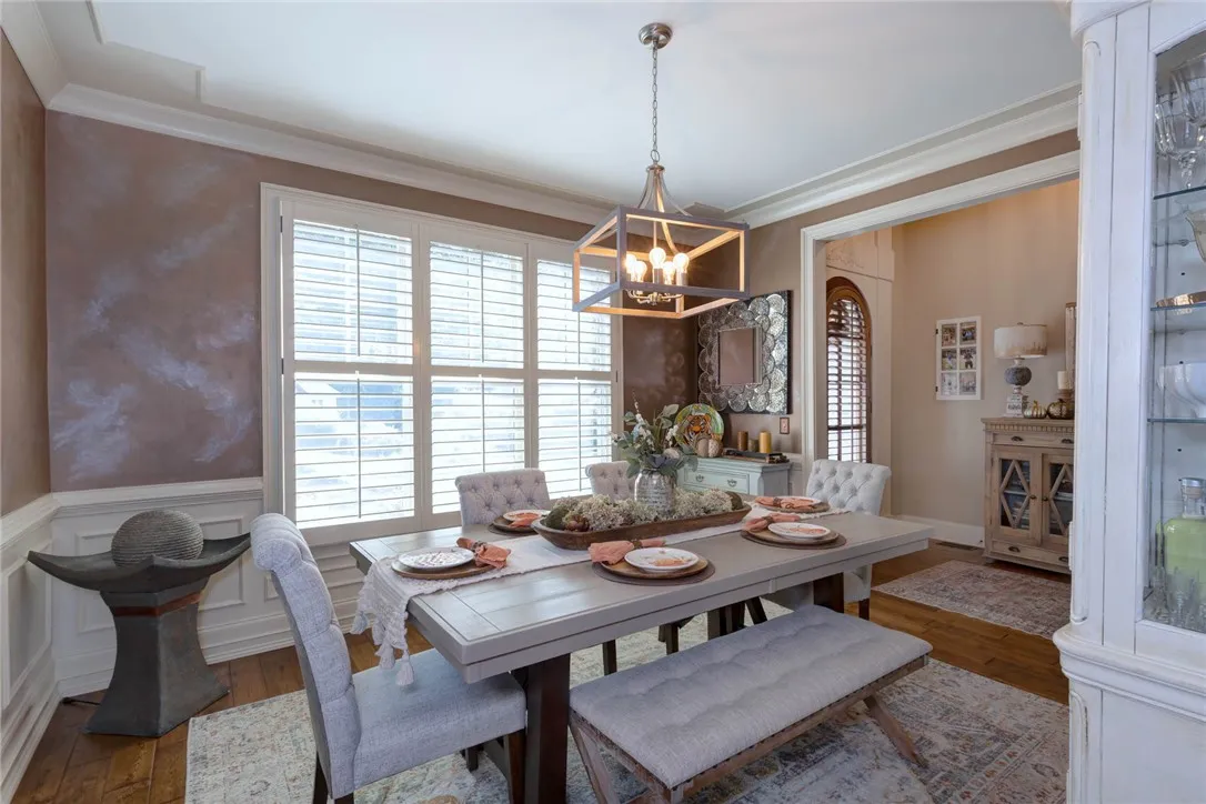 Crown molding and wainscoting bring traditional architectural detail to this formal dining area.