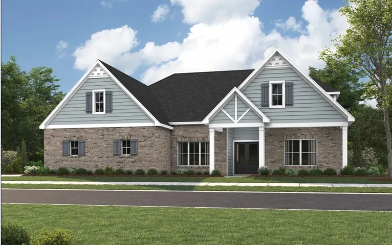 A classic brick exterior meets detailed siding beneath high gables on this stylish modern home.