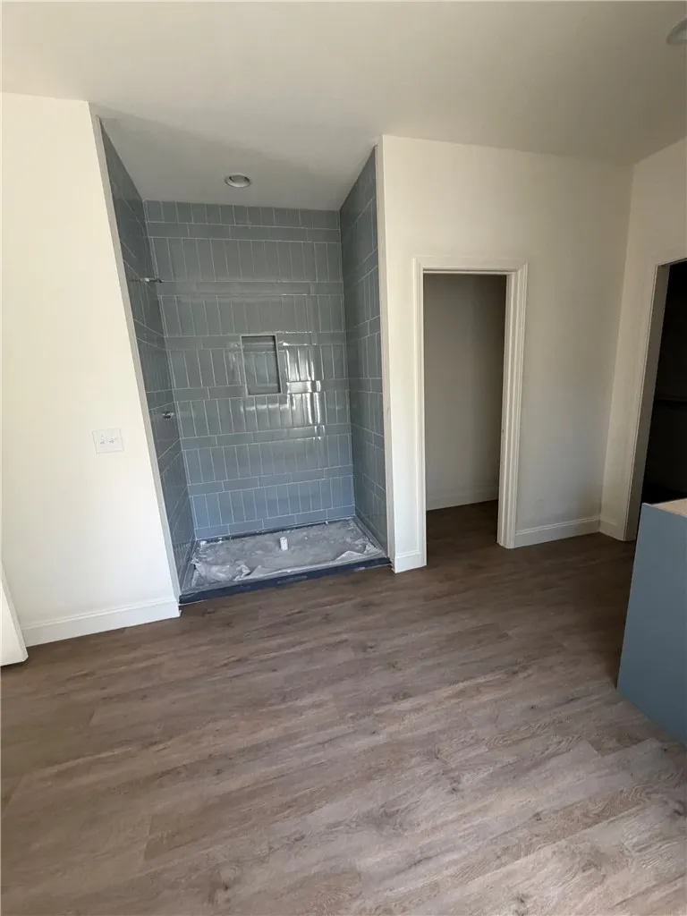 Clean lines and modern tile work define this newly updated bathroom space.