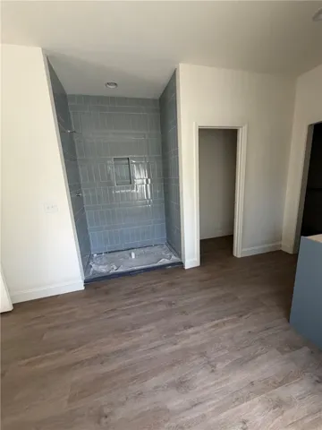 Clean lines and modern tile work define this newly updated bathroom space.
