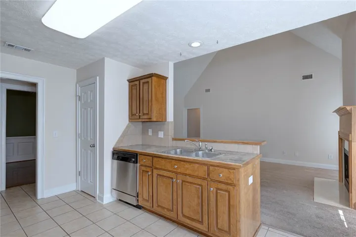 An open design connects the functional kitchen space directly to the soaring living area.