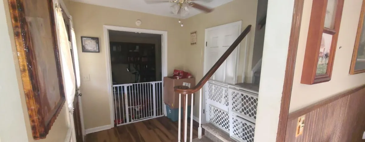 A welcoming entryway with durable laminate flooring and easy access to both levels.