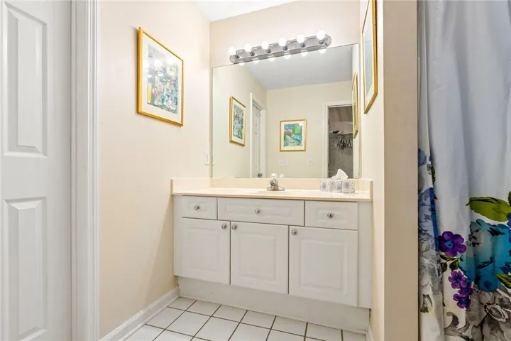 Clean lines and classic tiling define this well-appointed bathroom vanity area.