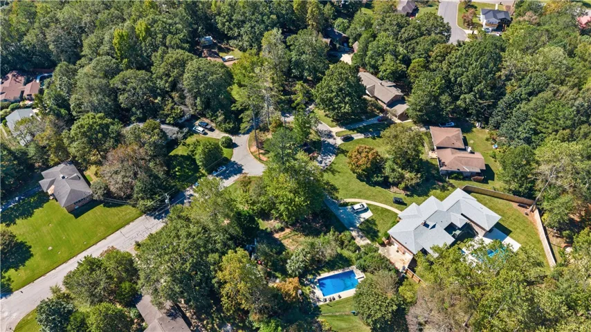 Mature trees and quiet residential streets surround this established suburban neighborhood.