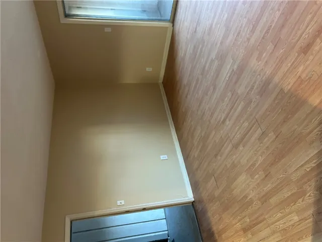 Warm wood-look flooring and clean lines define this versatile living space.