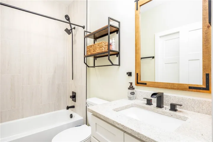 Clean lines and modern fixtures define this beautifully updated bathroom space.