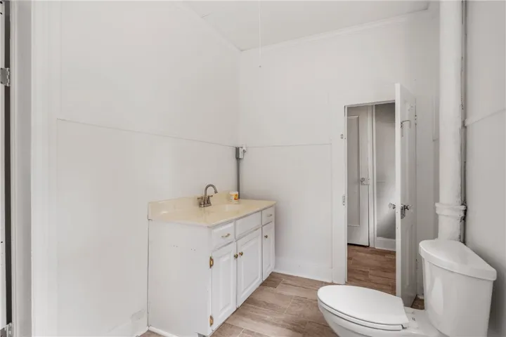 Crisp white walls and classic trim frame this functional bathroom layout.