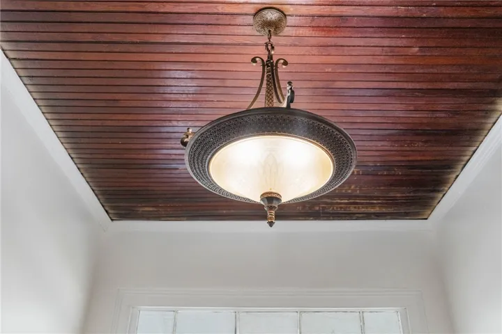 Rich wood planking elevates this ceiling with timeless historic charm.